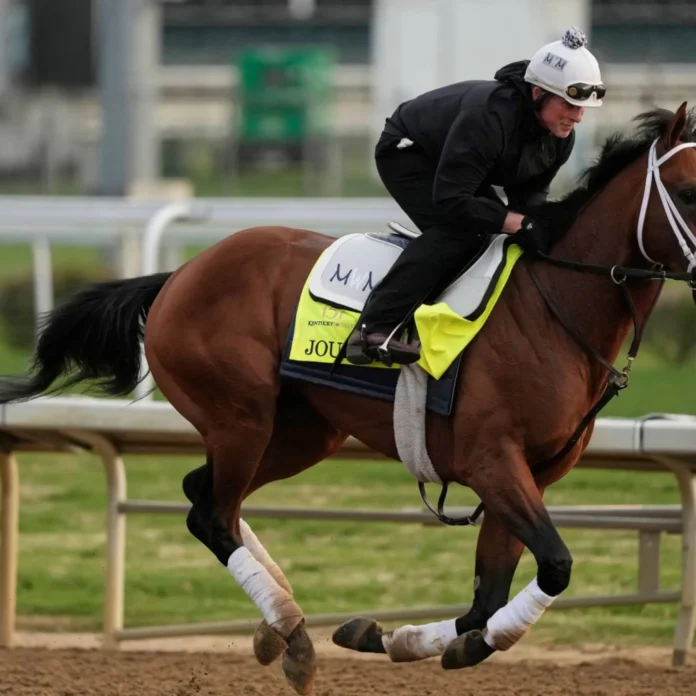 Jockey riding Journalism during a workout ahead of the 151st Kentucky Derby at Churchill Downs