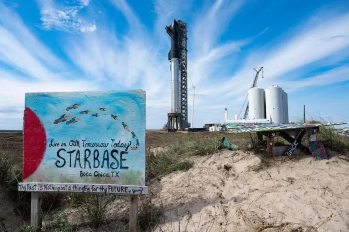 Starbase launch facility in Boca Chica, Texas with painted welcome sign and SpaceX rocket
